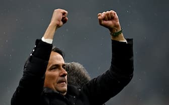 Inter Milan's Italian coach Simone Inzaghi celebrates winning the 2024 Scudetto championship title on April 22, 2024, following the Italian Serie A football match between AC Milan and Inter Milan at the San Siro Stadium in Milan. (Photo by GABRIEL BOUYS / AFP) (Photo by GABRIEL BOUYS/AFP via Getty Images)