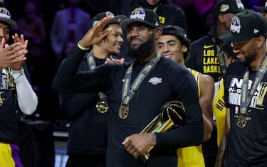 LAS VEGAS, NEVADA - DECEMBER 09: LeBron James #23 of the Los Angeles Lakers celebrates with the MVP trophy after winning the championship game of the inaugural NBA In-Season Tournament at T-Mobile Arena on December 09, 2023 in Las Vegas, Nevada. NOTE TO USER: User expressly acknowledges and agrees that, by downloading and or using this photograph, User is consenting to the terms and conditions of the Getty Images License Agreement. (Photo by Ethan Miller/Getty Images)