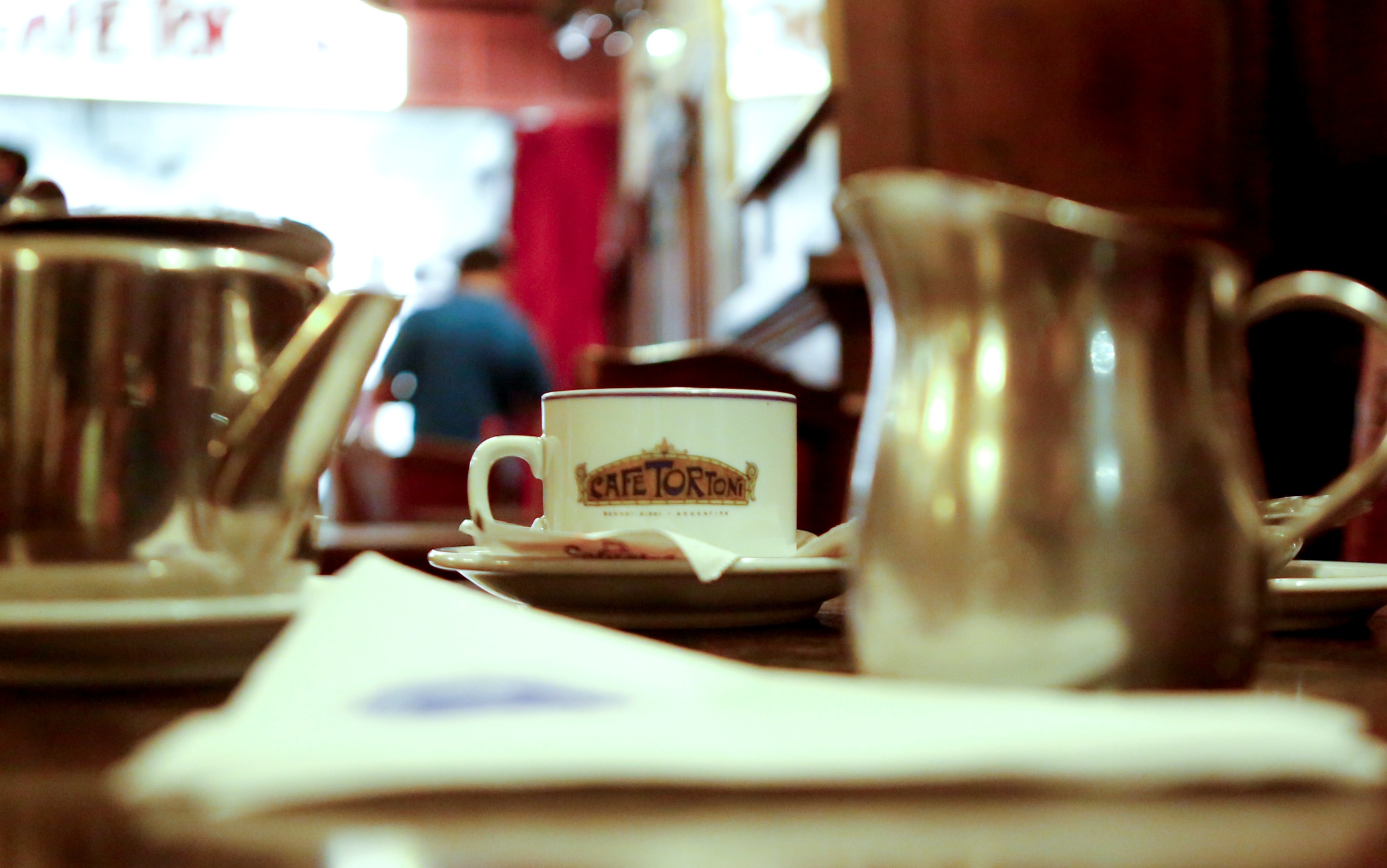 BUENOS AIRES, ARGENTINA - DECEMBER 18:  A tea set is served on the table Jorge Luis Borges used to sit at Caf� Tortoni on December 18, 2014 in Buenos Aires, Argentina. Caf� Tortoni was founded in 1858 by Jean Touan, a French inmigrant that named the Caf� Totoni after the resounding Caf� Tortoni de Paris. It is Argentina's eldest coffe place. From 1926 to 1943, this place gathered some of the most important artists of the time in his basement, were several shows were performed. Figures such as painter Benito Quinquela Mart�n, writer Jorge Luis Borges, singer Carlos Gardel and former Argentina's President Marcelo de Alvear gave the Caf� Tortoni the reputation to be declared "Site of Cultural Interest" in 1995. Caf� Tortoni is visited every day by hundreds of tourists and the room La Bodega, where the shows used to be hosted, now hosts jazz and tango sessions.  Buenos Aires City Government declared October 26th as the D�a de los Caf�s Porte�os (Day of the traditional caf�s of Buenos Aires) as a tribute of the foundation of Caf� Tortoni,156 years ago. (Photo by Gabriel Rossi/LatinContent/Getty Images)