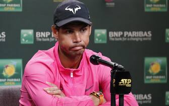 epa07443249 Rafael Nadal of Spain reacts to questions after announcing his withdrawal from his semifinal match against Roger Federer of Switzerland due to injury during the BNP Paribas Open tennis tournament at the Indian Wells Tennis Garden in Indian Wells, California, USA, 16 March 2019. The men's and women's final will be played, 17 March 2019.  EPA/JOHN G. MABANGLO