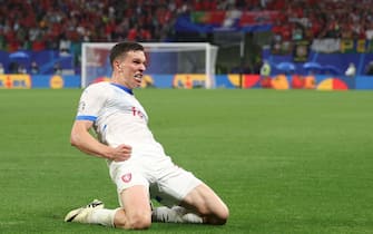 Czech Republic's midfielder #14 Lukas Provod celebrates after scoring his team's first goal during the UEFA Euro 2024 Group F football match between Portugal and the Czech Republic at the Leipzig Stadium in Leipzig on June 18, 2024. (Photo by Adrian DENNIS / AFP)