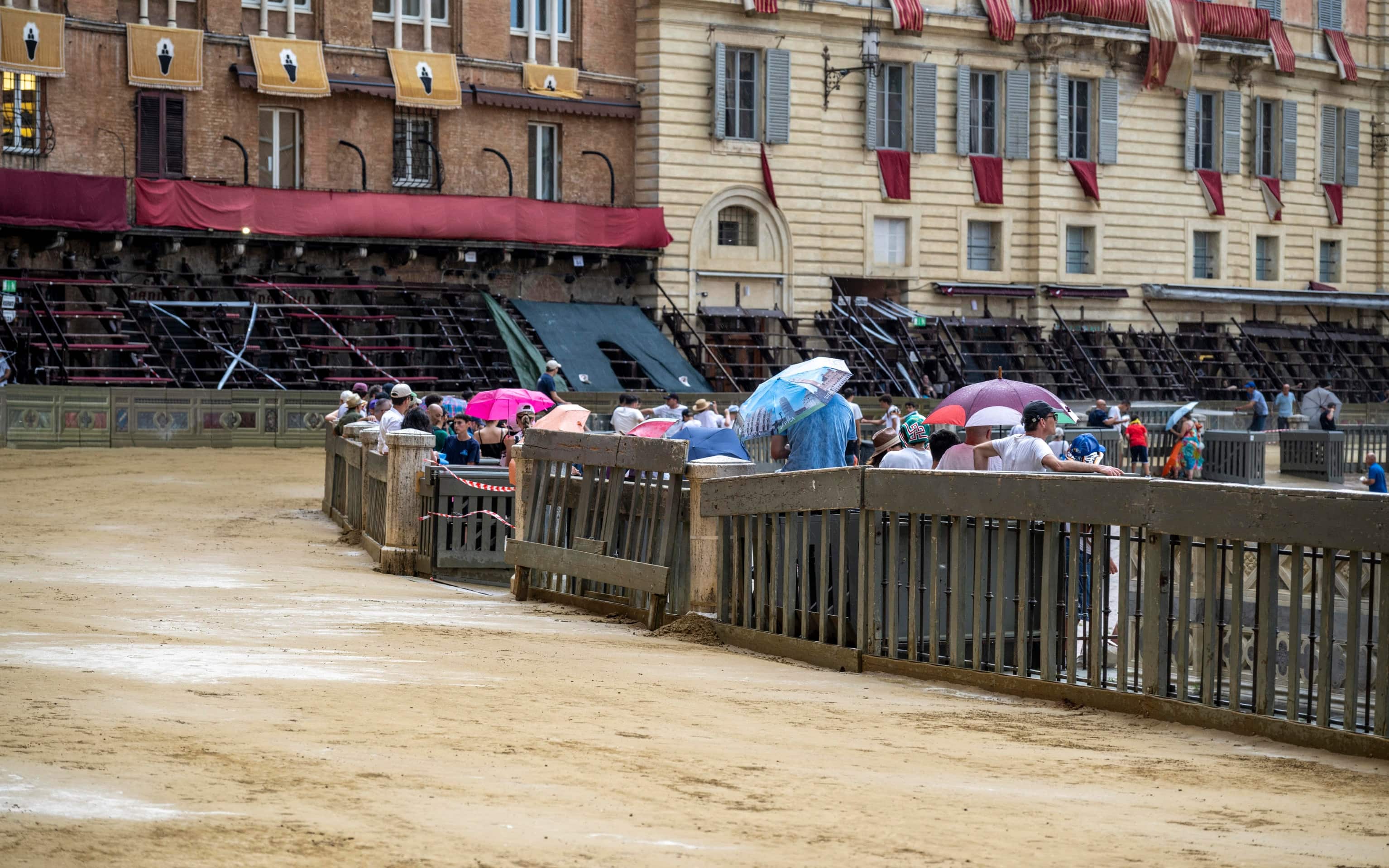 Spectators leave after the announcement that the historical horse race 'Palio di Siena' has been postponed to 03 July due to the rain in Siena, Italy, 02 July 2025. The traditional horse races between 17 Siena city districts called takes place on 02 July as the 'Palio di Provenzano' on the holiday of the Madonna of Provenzano and on 16 August 2025 as the 'Palio dell'Assunta' on the holiday of the Virgin Mary. 
ANSA/CLAUDIO GIOVANNINI