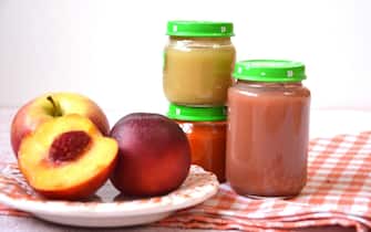 baby food, baby mashed in a glass jar, peach