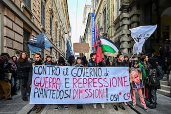 Protestors during a rally held next to University of Genoa to contest ministers Matteo Piantedosi and Matteo Salvini after Pisa clashes in Genoa, Italy, 4 March 2024. ANSA/SIMONE ARVEDA