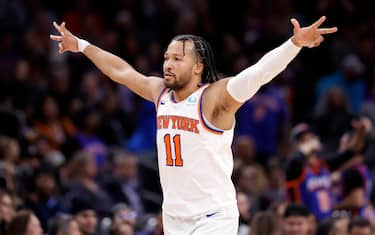 PHOENIX, ARIZONA - DECEMBER 15: Jalen Brunson #11 of the New York Knicks reacts after hitting a three point basket during the second half against the Phoenix Suns at Footprint Center on December 15, 2023 in Phoenix, Arizona. NOTE TO USER: User expressly acknowledges and agrees that, by downloading and or using this photograph, User is consenting to the terms and conditions of the Getty Images License Agreement.  (Photo by Chris Coduto/Getty Images)