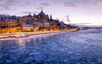 The photo is taken at sunset/twilight. The image displays the frozen sea in front of the 18th century housing facing Riddarfjärden. 

Södermalm (Swedish for 'Southern Island'), often shortened to just Söder, is a district and island in central Stockholm.