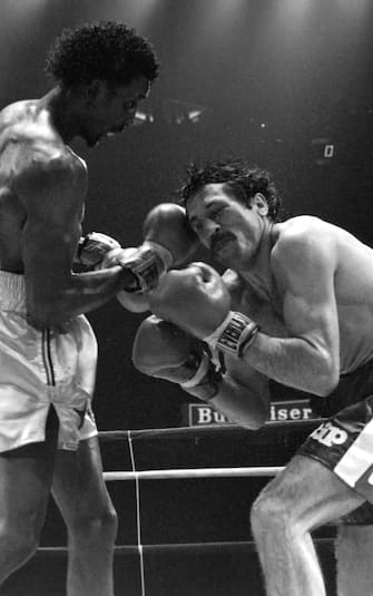 DETROIT - FEBRUARY 11,1984:  Thomas Hearns (L) lands a right hook against Luigi Minchillo during the fight at Joe Louis Arena on February 11,1984 in Detroit, Michigan. Thomas Hearns won the WBC light middleweight title by a UD 12. (Photo by: The Ring Magazine via Getty Images) 