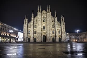 A view of deserted downtown in Milan, Italy, as the country marks the New Year in 'red zone' lockdown with a curfew from 10 pm to 7 am and New Year's Eve parties banned, 01 January 2021. From 10:00 pm to 07:00 am curfew is implemented in Italy to avoid a third wave of Covid-19 infections.
ANSA/ MATTEO CORNER