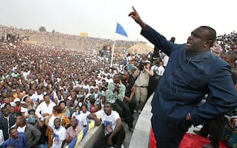 epa06921510 (FILE) - The presidential candidate Jean-Pierre Bemba (R) speaks to the crowd at an election rally in Kinshasa, Democratic Republic of Congo, 27 July 2006 (reissued 01 August 2018). Reports on 01 August 2018 state former DR Congo  opposition leader Jean-Pierre Bemba has arrived in Kinshasa. Bemba, who was convicted of war crimes at the International Criminal Court (ICC) in The Hague and then acquitted after an appeal, may plan to participate in the presidential elections in December 2018.  EPA/NIC BOTHMA *** Local Caption *** 00782527