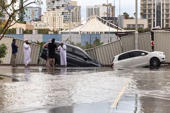 Damaged vehicles after a portion of a roadway collapsed after heavy rainfall in the Dubai Sports City district of Dubai, United Arab Emirates, on Tuesday, April 16, 2024. The United Arab Emirates experienced its heaviest downpour since records began in 1949, Dubai's media office said in a statement. Photographer: Christopher Pike/Bloomberg via Getty Images