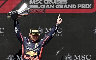 epa10777433 The winner, Dutch Formula One driver Max Verstappen of Red Bull Racing celebrates on the podium after the 2023 Formula 1 Belgian Grand Prix at the Circuit de Spa-Francorchamps racetrack in Stavelot, Belgium, 30 July 2023.  EPA/CHRISTIAN BRUNA