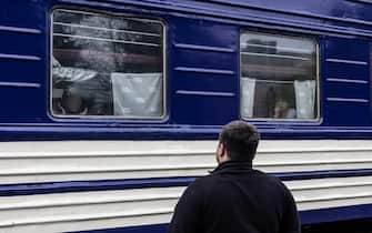 POKROVSK, UKRAINE - MAY 01: A father says goodbye to his son, who is on a train in the direction of Lviv, at railway station in Pokrovsk, Ukraine on May 01, 2023. (Photo by Diego Herrera Carcedo/Anadolu Agency via Getty Images)