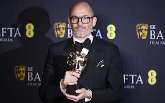 epa11901889 German director Edward Berger poses in the press room with the Best Film award for 'Conclave' during the BAFTA Film Awards at the Royal Festival Hall in London, Britain, 16 February 2025. The ceremony is hosted by the British Academy of Film and Television Arts (BAFTA).  EPA/TOLGA AKMEN