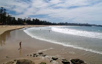 People enjoying the surf & sunshine at Manly beach,Sydney,New South Wales,Australia.