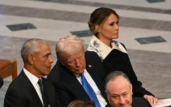 obama e trump funerali carter US President-elect Donald Trump speaks with former President Barack Obama as Melania Trump looks on during the State Funeral Service for former US President Jimmy Carter at the Washington National Cathedral in Washington, DC, on January 9, 2025. (Photo by Mandel NGAN / AFP)