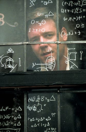 Russell Crowe looking out window in a scene from the film 'A Beautiful Mind', 2001. (Photo by Universal/Getty Images)