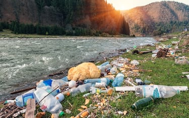 plastic garbage on the mountain river bank