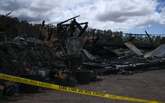 TOPSHOT - Police tape surrounds the site of a home destroyed by the Maui wildfires in Kula, Hawaii on August 13, 2023. The death toll in Hawaii from the deadliest US wildfire in more than a century was expected to cross the 100-mark Sunday August 13, fueling criticism that government inaction contributed to the heavy loss of life.
Officials say 93 people are known to have died, but warned the figure was likely to rise as recovery crews with cadaver dogs continued the grim task of searching burned out homes and vehicles in Lahaina. (Photo by Patrick T. Fallon / AFP) (Photo by PATRICK T. FALLON/AFP via Getty Images)