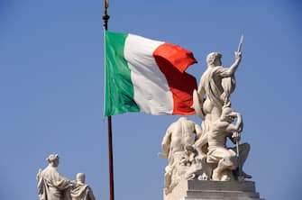 Italy, Rome, Piazza Venezia, Vittoriano, statues and italian flag