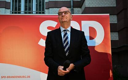 Brandenburg's State Premier and SPD top candidate in the regional elections in Brandenburg, Dietmar Woidke, reacts after the publication of the exit polls and before addressing party members and supporters at the election party venue of the Social Democratic Party SPD in Potsdam, eastern Germany on September 22, 2024, during regional state elections in the eastern German state of Brandenburg. Chancellor Scholz's Social Democrats were narrowly ahead of the far-right AfD in a closely-fought regional election Sunday in Germany's formerly communist east, according to exit polls. (Photo by Tobias SCHWARZ / AFP)