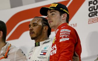 BAHRAIN INTERNATIONAL CIRCUIT, BAHRAIN - MARCH 31: Lewis Hamilton, Mercedes AMG F1, 1st position, and Charles Leclerc, Ferrari, 3rd position, on the podium during the Bahrain GP at Bahrain International Circuit on March 31, 2019 in Bahrain International Circuit, Bahrain. (Photo by Zak Mauger / LAT Images)