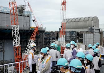 epa10760352 Journalists visit Tokyo Electric Power Company's (TEPCO) Fukushima Daiichi Nuclear Power Plant in Okuma, Fukushima Prefecture, northern Japan, 21 July 2023, to get hint when the TEPCO and Japanese government will start to release the radioactive water treated by the Advanced Liquid Processing System (ALPS) this summer. The nuclear power plant is located in tsunami-devastated towns of Okuma and Futaba.  EPA/KIMIMASA MAYAMA / POOL