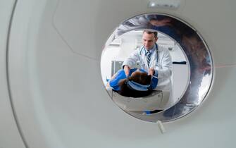 Doctor doing a CTA scan on a patient at the hospital - healthcare and medicine concepts 