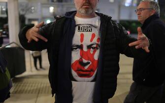 epa11092448 A protester wearing a shirt depicting Israeli Prime Minister Benjamin Netanyahu above which reads the word 'Guilty' in Hebrew during a demonstration against the government in Habima square in Tel Aviv, Israel , 20 January 2023. More than 24,700 Palestinians and at least 1,300 Israelis have been killed, according to the Palestinian Health Ministry and the Israel Defense Forces (IDF), since Hamas militants launched an attack against Israel from the Gaza Strip on 07 October, and the Israeli operations in Gaza and the West Bank which followed it.  EPA/ABIR SULTAN