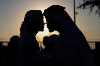 epa10583301 A UAE man (R) gives his son a traditional Emirati kiss, as they exchange congratulations on the occasion of the Muslim holiday of Eid al-Fitr during attending the Eid Al-Fitr prayer at Nad Al Hammar Eid Musalla in Dubai, United Arab Emirates, 21 April 2023. Muslims around the world celebrate Eid al-Fitr, the three day festival marking the end of the Muslim holy month of Ramadan, which is starting on 21 April and some other countries on 22th May depending on the lunar calendar. Eid al-Fitr is one of the two major holidays in Islam.  EPA/ALI HAIDER
