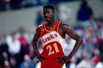 PORTLAND, OR - 1989: Dominique Wilkins #21 of the Atlanta Hawks looks on against the Portland Trailblazers at the Veterans Memorial Coliseum in Portland, Oregon circa 1989. NOTE TO USER: User expressly acknowledges and agrees that, by downloading and or using this photograph, User is consenting to the terms and conditions of the Getty Images License Agreement. Mandatory Copyright Notice: Copyright 1989 NBAE (Photo by Brian Drake/NBAE via Getty Images)