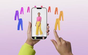 hands swiping clothing options on smart phone