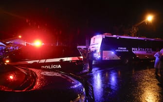 Police guard near the plane crash site in the neighborhood of Capela de Vinhedo, Sao Paulo state, Brazil, Aug. 9, 2024. A passenger plane crashed in the interior of the Brazilian state of Sao Paulo on Friday, killing all 61 aboard, the airline company Voepass confirmed. The black box of the plane had been recovered. Photo by Paulo Pinto/Agencia Brasil via Xinhua/ABACAPRESSC.OM