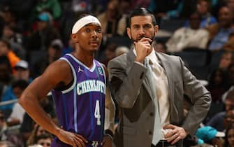 CHARLOTTE, NC - NOVEMBER 9: Devonte' Graham #4 of the Charlotte Hornets and Head Coach, James Borrego of the Charlotte Hornets look on during the game against the New Orleans Pelicans on November 9, 2019 at Spectrum Center in Charlotte, North Carolina. NOTE TO USER: User expressly acknowledges and agrees that, by downloading and or using this photograph, User is consenting to the terms and conditions of the Getty Images License Agreement.  Mandatory Copyright Notice:  Copyright 2019 NBAE (Photo by Brock Williams-Smith/NBAE via Getty Images)