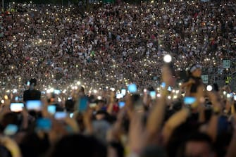 People attend the concert of Italian glam rock band Maneskin (vocalist Damiano David, bassist Victoria De Angelis, guitarist Thomas Raggi and drummer Ethan Torchio) at the Circus Maximus in Rome, Italy, 09 July 2022.
ANSA/CLAUDIO PERI