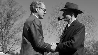 L to R: Robert Downey Jr is Lewis Strauss and Cillian Murphy is J. Robert Oppenheimer in OPPENHEIMER, written, produced, and directed by Christopher Nolan.