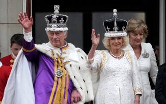 LONDON, ENGLAND - MAY 06: King Charles III and Queen Camilla can be seen on the Buckingham Palace balcony ahead of the flypast during the Coronation of King Charles III and Queen Camilla on May 06, 2023 in London, England. The Coronation of Charles III and his wife, Camilla, as King and Queen of the United Kingdom of Great Britain and Northern Ireland, and the other Commonwealth realms takes place at Westminster Abbey today. Charles acceded to the throne on 8 September 2022, upon the death of his mother, Elizabeth II. (Photo by Christopher Furlong/Getty Images)