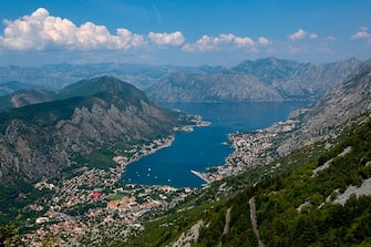 A picture taken on August 7, 2018 shows the bay of Kotor. - Montenegro's medieval walled city of Kotor, an Adriatic seaport cradled in a spectacular fjord-like bay, has survived centuries of weather and warfare. Now it is facing a different kind of assault, that of gargantuan cruise ships disgorging throngs of tourists threatening a place that was only a few years ago commonly described as a "hidden gem". (Photo by Savo PRELEVIC / AFP)        (Photo credit should read SAVO PRELEVIC/AFP via Getty Images)