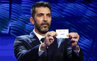 epa11007762 Italian former football player Gianluigi Buffon holds a ticket of Spain during the UEFA EURO 2024 final tournament draw at the Elbphilharmonie in Hamburg, Germany, 02 December 2023. The UEFA EURO 2024 will take place in Germany from 14 June to 14 July.  EPA/FILIP SINGER