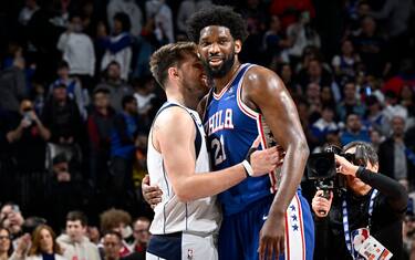 PHILADELPHIA, PA - MARCH 29: Joel Embiid #21 of the Philadelphia 76ers talks with Luka Doncic #77 of the Dallas Mavericks during the game on March 29, 2023 at the Wells Fargo Center in Philadelphia, Pennsylvania NOTE TO USER: User expressly acknowledges and agrees that, by downloading and/or using this Photograph, user is consenting to the terms and conditions of the Getty Images License Agreement. Mandatory Copyright Notice: Copyright 2023 NBAE (Photo by David Dow/NBAE via Getty Images)