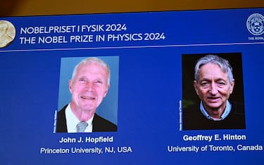 epa11648732 A screen shows the pictures of the 2024 Nobel Prize laureates in Physics, during a press conference in Stockholm, Sweden, 08 October 2024. The Royal Swedish Academy of Sciences has decided to award the Nobel Prize in Physics 2024 to John J. Hopfield and Geoffrey E. Hinton 'for foundational discoveries and inventions that enable machine learning with artificial neural networks', the Nobel statement reads.  EPA/Christine Olsson/TT  SWEDEN OUT
