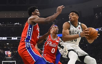 MILWAUKEE, WISCONSIN - FEBRUARY 22:  Giannis Antetokounmpo #34 of the Milwaukee Bucks is defended by Joel Embiid #21 of the Philadelphia 76ers during a game at Fiserv Forum on February 22, 2020 in Milwaukee, Wisconsin. NOTE TO USER: User expressly acknowledges and agrees that, by downloading and or using this photograph, User is consenting to the terms and conditions of the Getty Images License Agreement.  (Photo by Stacy Revere/Getty Images)