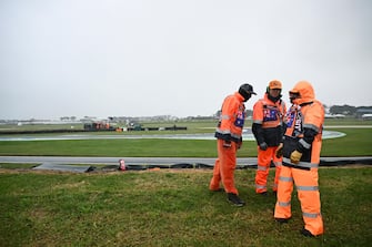 epa10932155 Marshals on turn four during the Moto2 Australian Motorcycle Grand Prix at the Phillip Island Grand Prix Circuit on Phillip Island, Victoria, Australia 22 October 2023.  EPA/JOEL CARRETT AUSTRALIA AND NEW ZEALAND OUT
