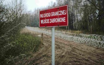 A "No Entry" sign at the construction site of a razor wire fence along the Polish border, with the Russian enclave of Kaliningrad, near Zerdziny, Poland, on Saturday, Nov. 5, 2022. The Baltic region of Kaliningrad, cut off from the rest of Russia after the independence of the Baltic states in 1990, was in German hands for centuries until it was seized and annexed by the Soviet Union in 1945. Photographer: Damian Lemankski/Bloomberg