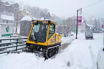 epa11086081 A snow plow clears the sidewalk on Old Main Street the day before the start of the 2024 Sundance Film Festival in Park City, Utah, USA, 17 January 2024. The festival runs from 18-28 January 2024.  EPA/George Frey