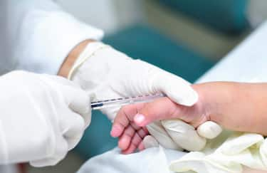 Intravenous medicine administration to a child, in a children hospital.  Guayaquil, Ecuador.