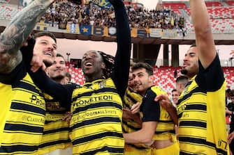 BARI, ITALY - MAY 01: Wylan Cyprien of Parma celebrates with teammates the promotion to Serie A after a Serie B match between Bari and Parma at Stadio San Nicola on May 01, 2024 in Bari, Italy. (Photo by Donato Fasano/Getty Images)