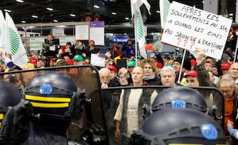PARIS, FRANCE - FEBRUARY 24: 
French farmers protest inside the Porte de Versailles exhibition centre on the day of French President Emmanuel Macron's visit to the International Agriculture Fair (Salon International de l'Agriculture) during its inauguration on February 24, 2024 in Paris, France. Several dozen demonstrators entered the Salon without authorization on Saturday morning to try to meet the Head of State after several weeks of mobilizations by part of the agricultural world. (Photo by Chesnot/Getty Images)