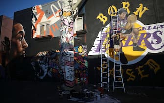 LOS ANGELES, CALIFORNIA - FEBRUARY 14: A mural depicting deceased NBA star Kobe Bryant is painted by @gz.jr on a building on February 14, 2020 in Los Angeles, California. Numerous murals depicting Bryant have been created around greater Los Angeles following their tragic deaths in a helicopter crash which left a total of nine dead. A public memorial service honoring Bryant will be held February 24 at the Staples Center in Los Angeles, where Bryant played most of his career with the Los Angeles Lakers.  (Photo by Mario Tama/Getty Images)