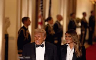 WASHINGTON, DC - FEBRUARY 22: U.S. President Donald Trump and First Lady Melania Trump arrive for the National Governors Association Evening Dinner and Reception in the East Room of the White House on February 22, 2025 in Washington, DC. Trump is hosting the governors in Washington for the annual National Governors Association meetings. (Photo by Tierney L. Cross/Getty Images)