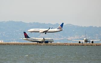 SAN FRANCISCO, UNITED STATES - JUNE 8: A Delta Airlines plane takeoff as a United plane is landing at San Francisco International Airport (SFO) in San Francisco, California, United States on June 8, 2023. (Photo by Tayfun CoSkun/Anadolu Agency via Getty Images)